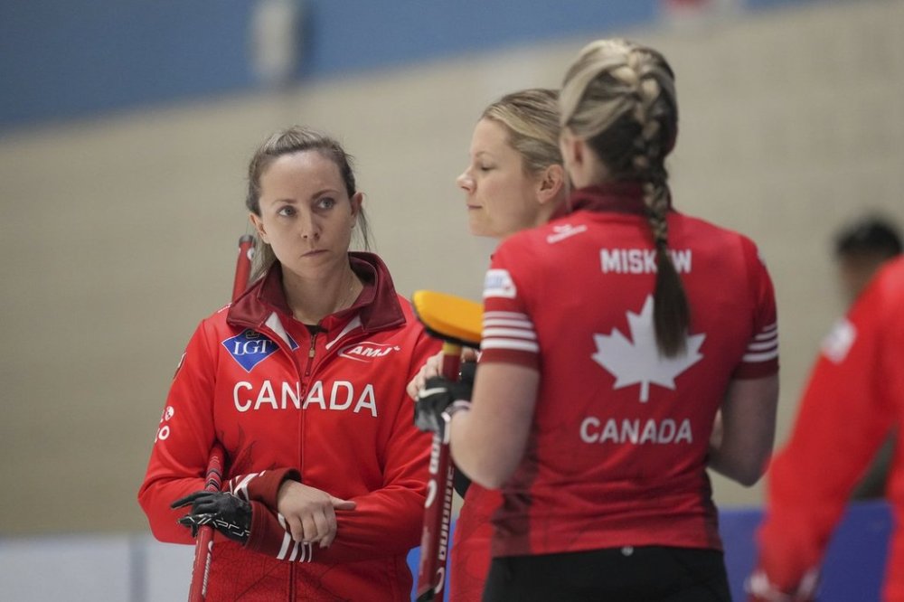 Canada's skip Rachel Homan, left, listens to Emma Miskew, right, during the semifinal match against South Korea at the World Women's Curling Championship in Uijeongbu, South Korea, Saturday, March 22, 2025. (AP Photo/Lee Jin-man)