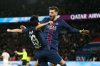 PSG's Khvicha Kvaratskhelia, right, and PSG's Lee Kang-in celebrate after their teammate PSG's Goncalo Ramos scored his side's opening goal during the French League One soccer match between Paris Saint Germain and Nice in Paris, Saturday, Nov. 1, 2025. (AP Photo/Aurelien Morissard)