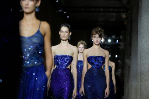 Models wear creations as part of the Giorgio Armani Spring/Summer 2026 collection show in Milan, Italy, Sunday, Sept. 28, 2025. (AP Photo/Luca Bruno)