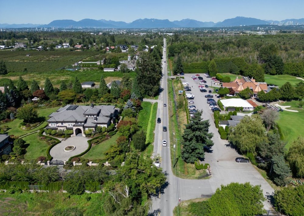 A residence bordered by farmland along No. 6 Road and Country Meadows Golf Course, right, which fall within the boundaries of a Cowichan Nation Aboriginal title claim, are seen in an aerial view in Richmond, B.C., on Friday, Aug. 22, 2025. THE CANADIAN PRESS/Darryl Dyck