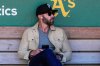 FILE - Miami Marlins assistant general manager Gabe Kapler sits in the dugout before the team's baseball game against the Oakland Athletics, May 3, 2024, in Oakland, Calif. (AP Photo/Godofredo A. Vásquez, File)