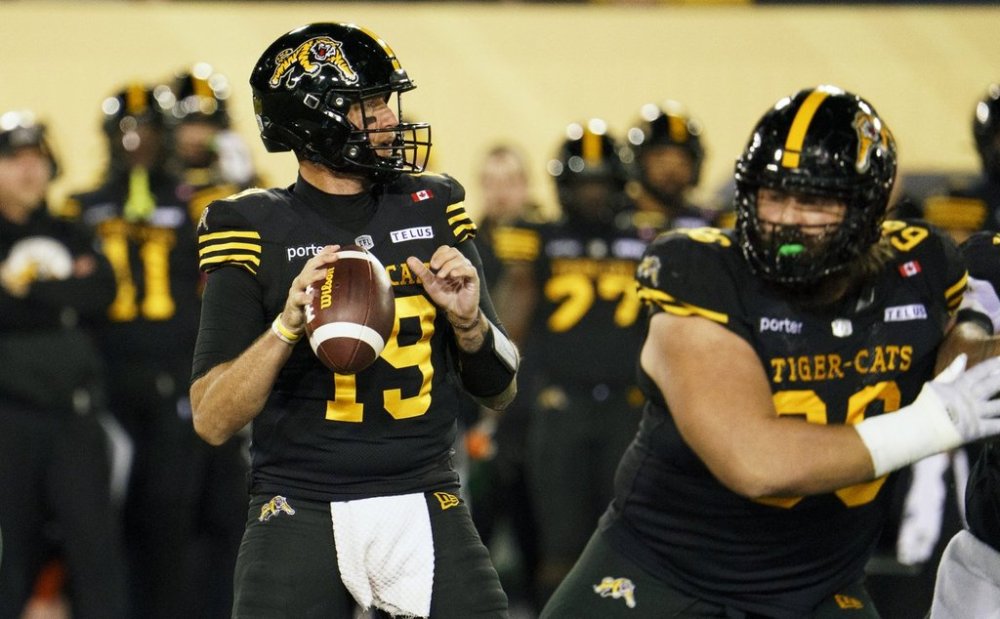 Hamilton Tiger-Cats quarterback Bo Levi Mitchell (19) looks to pass during first half CFL football game action against the Ottawa Redblacks in Hamilton, Ont. on Friday, October 24, 2025. THE CANADIAN PRESS/Peter Power