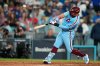 Philadelphia Phillies' Kyle Schwarber connects for a two-run home run during the eighth inning in Game 3 of baseball's National League Division Series against the Los Angeles Dodgers, Wednesday, Oct. 8, 2025, in Los Angeles. (AP Photo/Mark J. Terrill)
