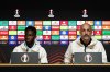 Maccabi Tel Aviv's Issouf Sissokho, left, and head coach Zarko Lazetic listen during a press conference, Wednesday, Nov. 5, 2025, in Birmingham, England, a day ahead of a Europa League soccer match against Aston Villa. (Jacob King/PA via AP)