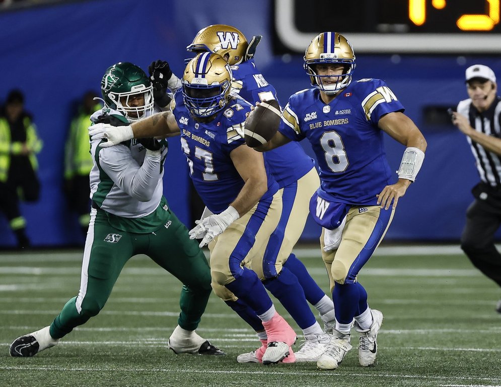 Winnipeg Blue Bombers quarterback Zach Collaros (8) looks downfield during first half CFL action against the Saskatchewan Roughriders in Winnipeg, Friday, Oct. 17, 2025. THE CANADIAN PRESS/John Woods