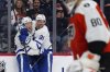 Toronto Maple Leafs winger Easton Cowan, left, celebrates his first NHL goal with centre John Tavares (91) in a game against the Flyers in Philadelphia on Saturday, Nov. 1, 2025. (AP Photo/Derik Hamilton)