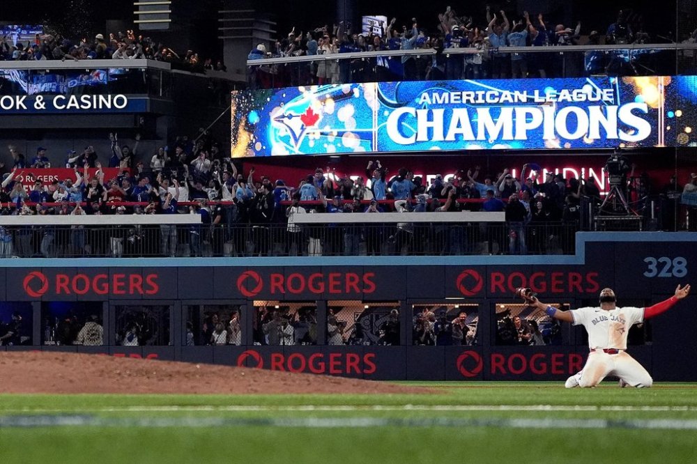 Toronto Blue Jays' Vladimir Guerrero Jr. celebrates after the final out of Game 7 of baseball's American League Championship Series, Monday, Oct. 20, 2025, in Toronto. (Nathan Denette/The Canadian Press via AP)