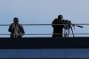 Snipers patrol on the roof of the Fruili Hotel where the Israeli national team is staying, ahead of a World Cup 2026, Group I qualifying soccer match between Italy and Israel at the Friuli Stadium in Udine, Italy, Tuesday, Oct.14, 2025. (AP Photo/Luca Bruno)