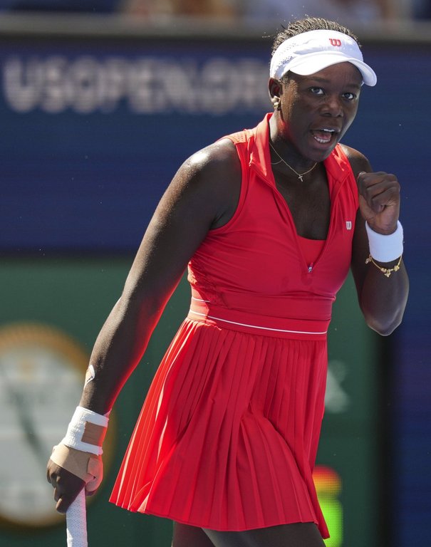 Victoria Mboko, of Canada, reacts after scoring a point against Barbora Krejcikova, of the Czech Republic, during the first round of the US Open tennis championships, Monday, Aug. 25, 2025, in New York. (AP Photo/Kirsty Wigglesworth)