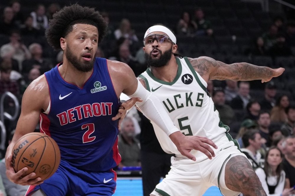 Detroit Pistons' Cade Cunningham gets past Milwaukee Bucks' Gary Trent Jr. during the first half of a preseason NBA basketball game Thursday, Oct. 9, 2025, in Milwaukee. (AP Photo/Morry Gash)