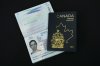 The new Canadian passport is unveiled at an event at the Ottawa International Airport in Ottawa on Wednesday, May 10, 2023. THE CANADIAN PRESS/Sean Kilpatrick