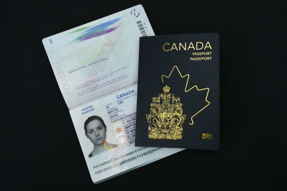 The new Canadian passport is unveiled at an event at the Ottawa International Airport in Ottawa on Wednesday, May 10, 2023. THE CANADIAN PRESS/Sean Kilpatrick