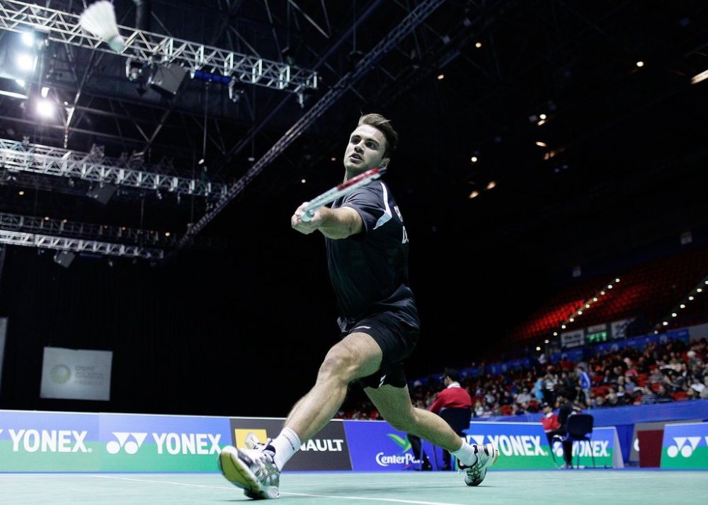FILE - Denmark's Joachim Persson hits a shot during his men's singles first round match against South Korea's Lee Hyun Il at the All England Badminton Championships in the National Indoor Arena, Birmingham, England, Wednesday, March 9, 2011. (AP Photo/Simon Dawson, file)