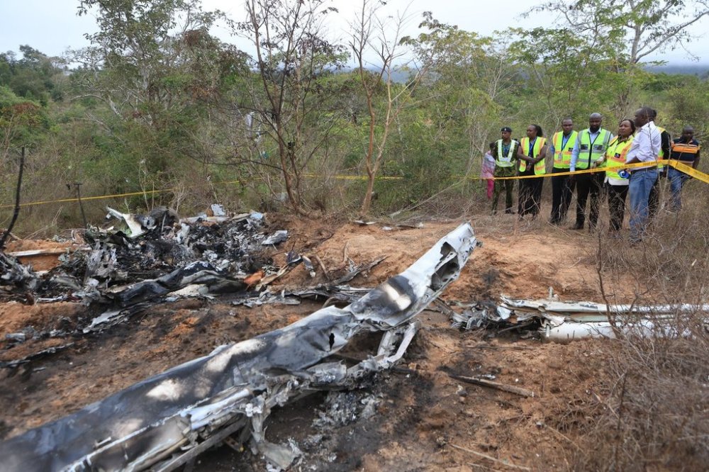 Kenya Principal Secretary State Department for Aviation and Aerospace Development Teresia Mbaika (second right) and other top government officials inspect Wednesday, Oct. 29, 2025 the scene of a plane crash that killed 12 people near Diani, Kenya, (AP Photo/Andrew Kasuku)