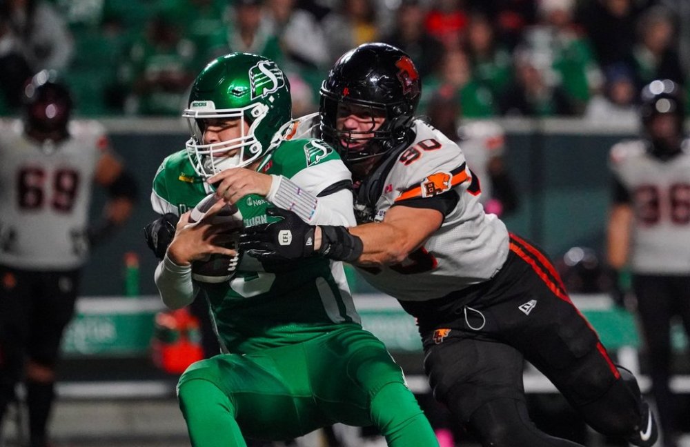 B.C. Lions defensive lineman Mathieu Betts (90) tackles Saskatchewan Roughriders quarterback Jake Maier (9) during the second half of CFL football action in Regina, on Saturday, October 25, 2025. THE CANADIAN PRESS/Heywood Yu