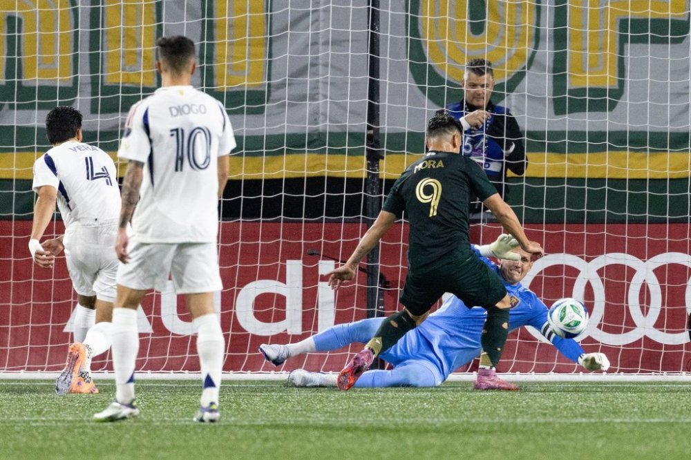 Portland Timbers forward Felipe Mora, middle, scores a goal against Real Salt Lake during the first half of an MLS soccer match Wednesday, Oct. 22, 2025, in Portland, Ore. (AP Photo/Howard Lao)