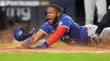 Toronto Blue Jays Vladimir Guerrero Jr. dives into home plate to score against the New York Yankees during the third inning of Game 3 of baseball's American League Division Series, Tuesday, Oct. 7, 2025, in New York. (AP Photo/Frank Franklin II)