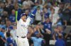 Toronto Blue Jays' George Springer reacts after hitting a three-run home run against the Seattle Mariners during the seventh inning of the MLB American League Championship Series Game 7 in Toronto, Monday, Oct. 20, 2025. THE CANADIAN PRESS/Nathan Denette