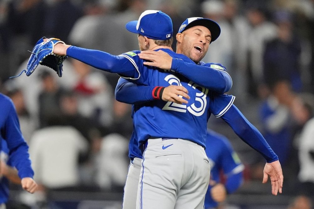 The Toronto Blue Jays celebrate after defeating the New York Yankees in Game 4 of baseball's American League Division Series, Wednesday, Oct. 8, 2025, in New York. (AP Photo/Frank Franklin II)