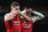 Arsenal's Viktor Gyoekeres, left, celebrates with Arsenal's Gabriel after scoring his side's third goal during the Champions League opening phase soccer match between Arsenal and Atletico Madrid in London, England, Tuesday, Oct. 21, 2025. (AP Photo/Alastair Grant)