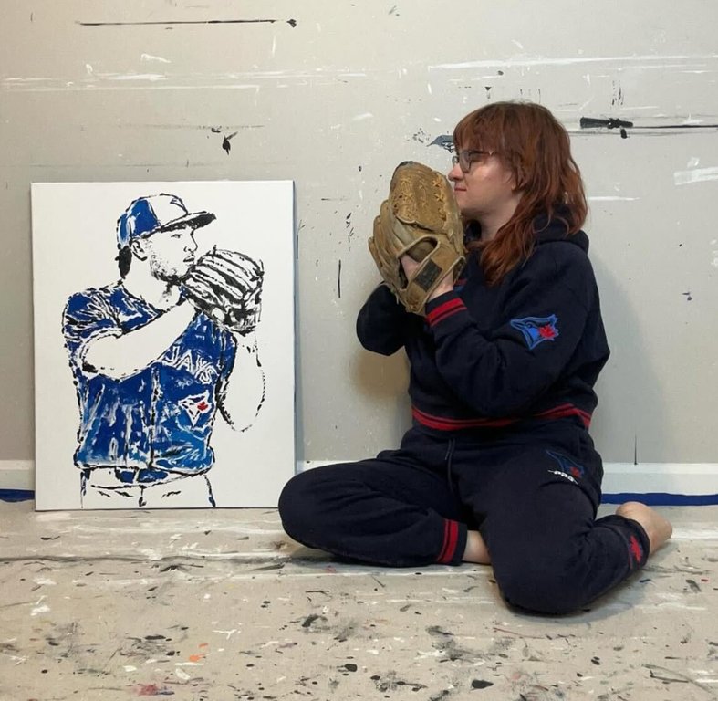 Samantha Woj, seen in this undated handout photo, uses baseball bats, balls and gloves to create paintings of iconic Toronto Blue Jays moments. THE CANADIAN PRESS/Handout - Instagram, @samwojart (Mandatory Credit)
