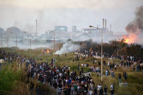People protest and clash with police during a demonstration against pollution caused by chemical factories, in Gabes, Tunisia, Wednesday, Oct. 16, 2025. (AP Photo/Bassem Aouini)