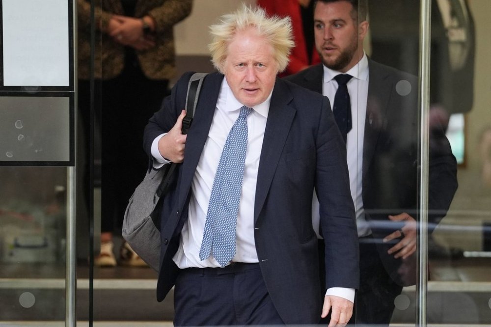 Former prime minister Boris Johnson leaves Dorland House in London after giving evidence for module 8 (children and young people) in the UK Covid-19 Inquiry, on Tuesday Oct. 21, 2025. (Lucy North/PA via AP)