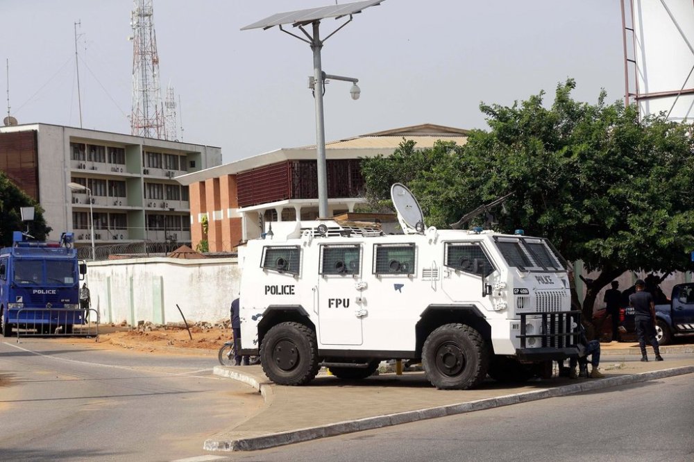 FILE - Police stand guard at the entrance of Ghana electoral commission office in Accra Ghana, Dec. 9, 2016. (AP Photo/Sunday Alamba, File)
