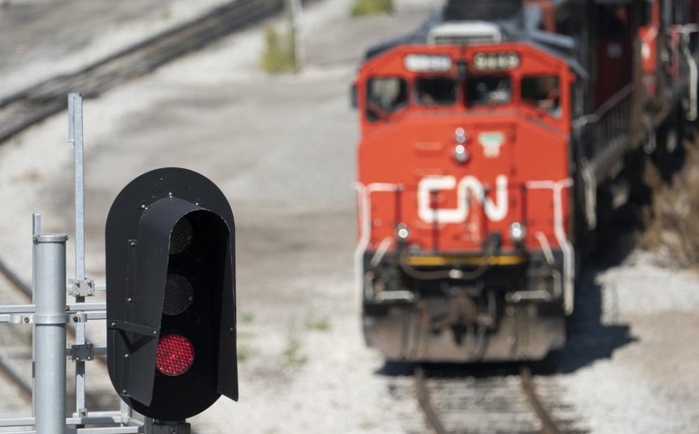 A CN locomotive sits idle at the CN Stuart Yard in Hamilton, Ont., Thursday, Aug. 22, 2024. THE CANADIAN PRESS/Peter Power