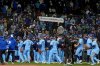 The Toronto Blue Jays celebrate after Game 3 of baseball's American League Championship Series against the Seattle Mariners, Wednesday, Oct. 15, 2025, in Seattle. (AP Photo/Lindsey Wasson)