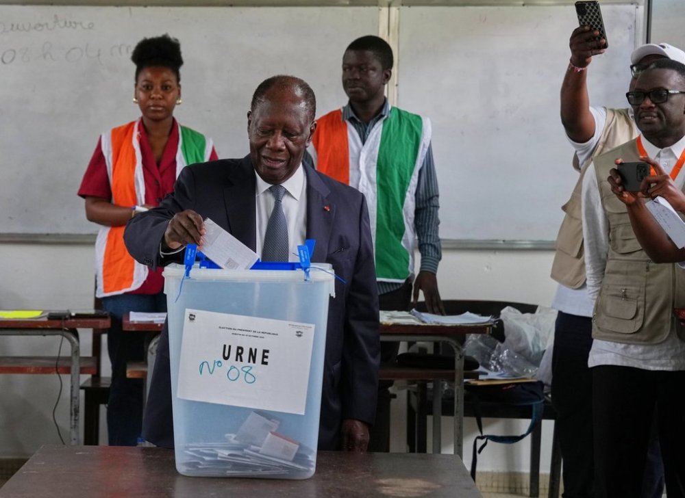 Ivory Coast President Alassane Ouattara casts his vote at a polling station during the presidential elections in Abidjan, Ivory Coast, Saturday, Oct. 25, 2025. (AP Photo/Misper Apawu)