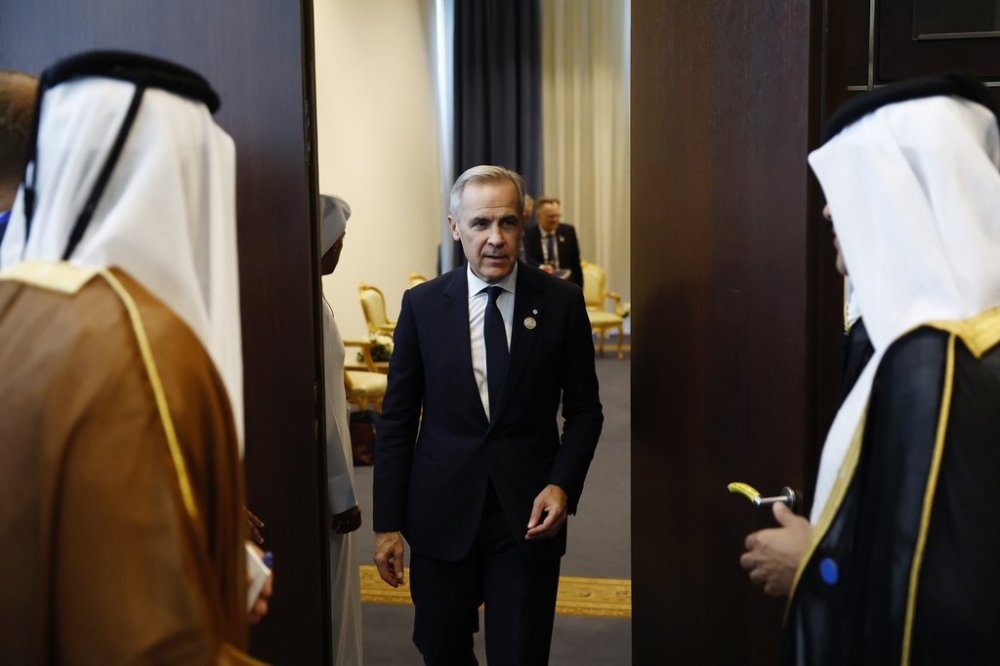 Canadian Prime Minister Mark Carney leaves a bilateral meeting with Emir of Qatar Cheikh Tamim ben Hamad al-Thani at the Gaza International Peace Summit, in Sharm el-Sheikh, Egypt, Monday, Oct.13 2025. (Yoan Valat, Pool photo via AP)