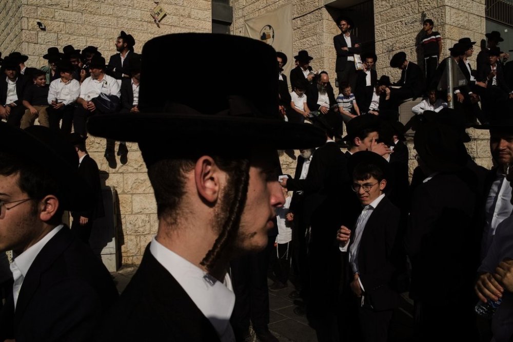 Ultra-Orthodox Jewish men gather for a rally against plans to force them to serve in the Israeli military, in Jerusalem, Thursday, Oct. 30, 2025. (AP Photo/Leo Correa)