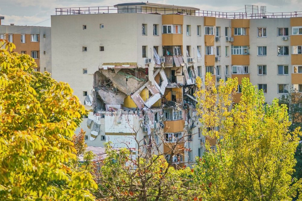 A view of of a damaged apartment building after powerful gas explosion in a residential block in Bucharest, Romania, Friday, Oct. 17, 2025. (AP Photo)