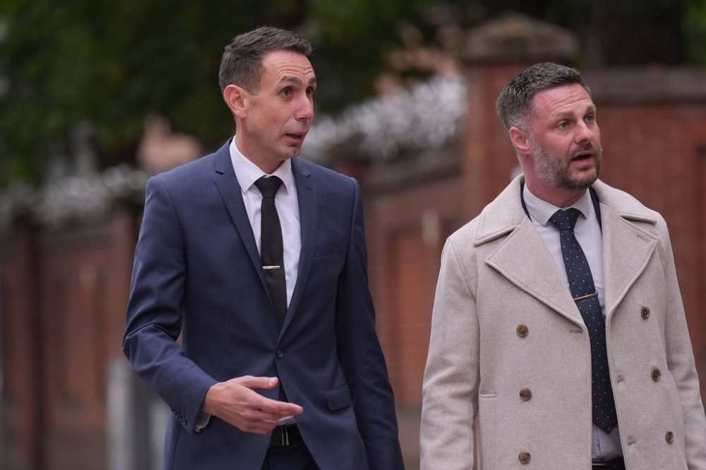 Former Premier League referee David Coote, left, arrives at Nottingham Crown Court where he is charged with making an indecent image of a child, in Nottingham, England, Tuesday Oct. 14, 2025. (Joe Giddens/PA via AP)