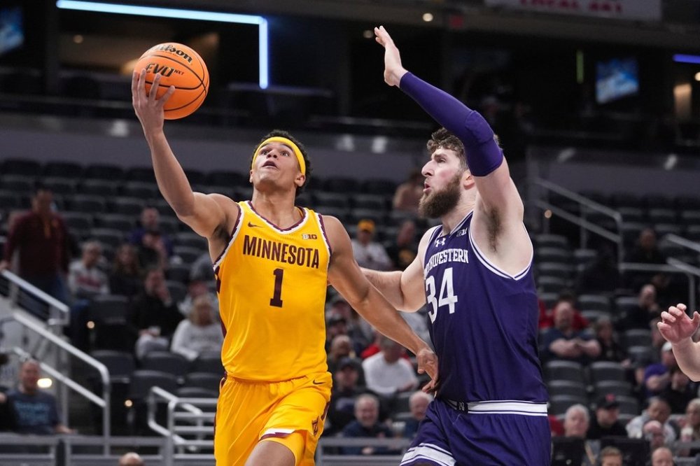 FILE - Minnesota guard Isaac Asuma (1) drives on Northwestern center Matthew Nicholson (34) during the second half of an NCAA college basketball game in the first round of the Big Ten Conference tournament in Indianapolis, March 12, 2025. (AP Photo/Michael Conroy, File)