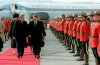 Prime Minister Brian Mulroney and President Ronald Reagan walk past a line of Royal Canadian Mounted Police on March 17, 1985, at the Quebec City airport. THE CANADIAN PRESS/Paul Chiasson