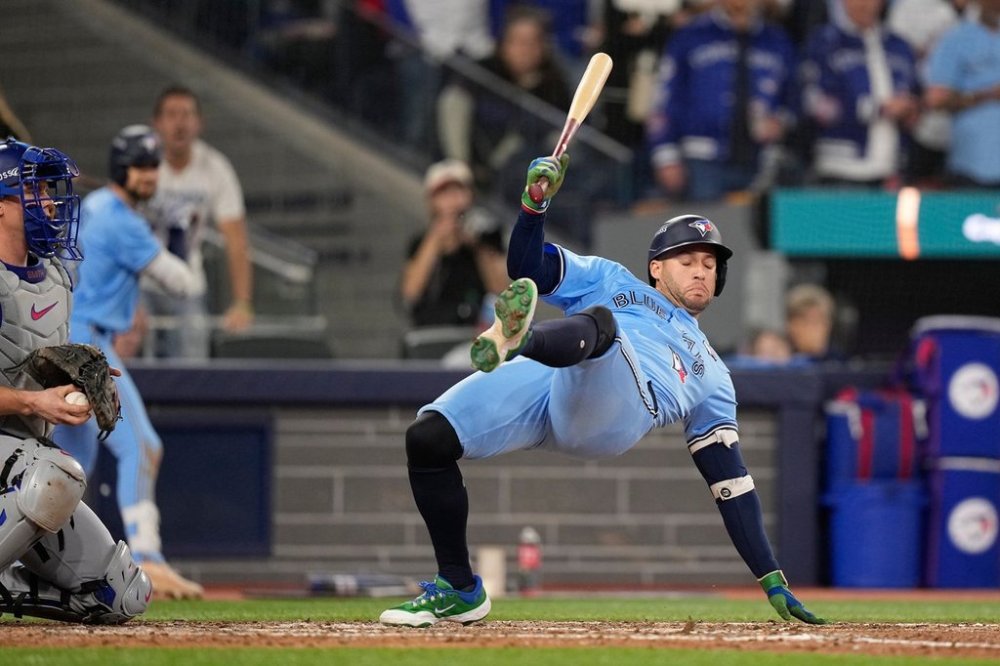 Toronto Blue Jays' George Springer gets out of the way of a pitch against the Los Angeles Dodgers during the eighth inning in Game 6 of baseball's World Series, Friday, Oct. 31, 2025, in Toronto. (AP Photo/Brynn Anderson)