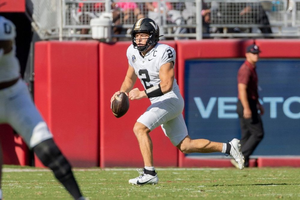 Vanderbilt quarterback Diego Pavia (2) rolls out on a run during the first half of an NCAA college football game against Alabama, Saturday, Oct. 4, 2025, in Tuscaloosa, Ala. (AP Photo/Vasha Hunt)