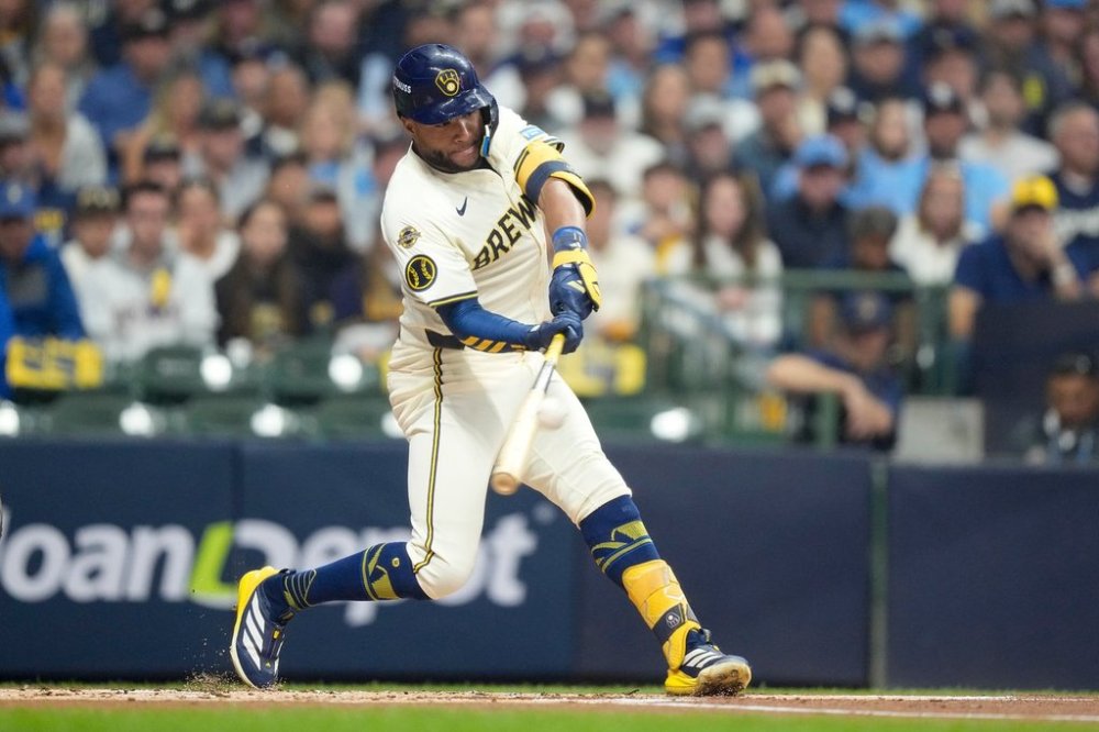 Milwaukee Brewers' Jackson Chourio hits a home run against the Los Angeles Dodgers during the first inning in Game 2 of baseball's National League Championship Series, Tuesday, Oct. 14, 2025, in Milwaukee. (AP Photo/Brynn Anderson)