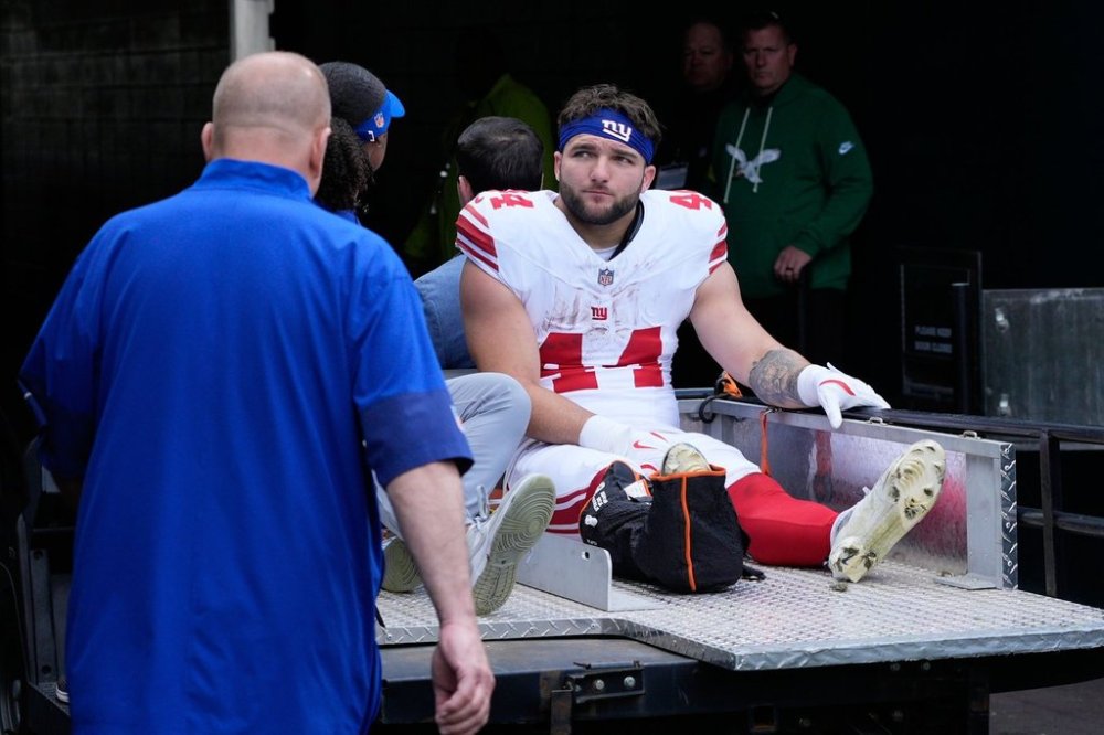 New York Giants running back Cam Skattebo (44) leaves the field after an injury during the first half of an NFL football game against the Philadelphia Eagles on Sunday, Oct. 26, 2025, in Philadelphia. (AP Photo/Chris Szagola)