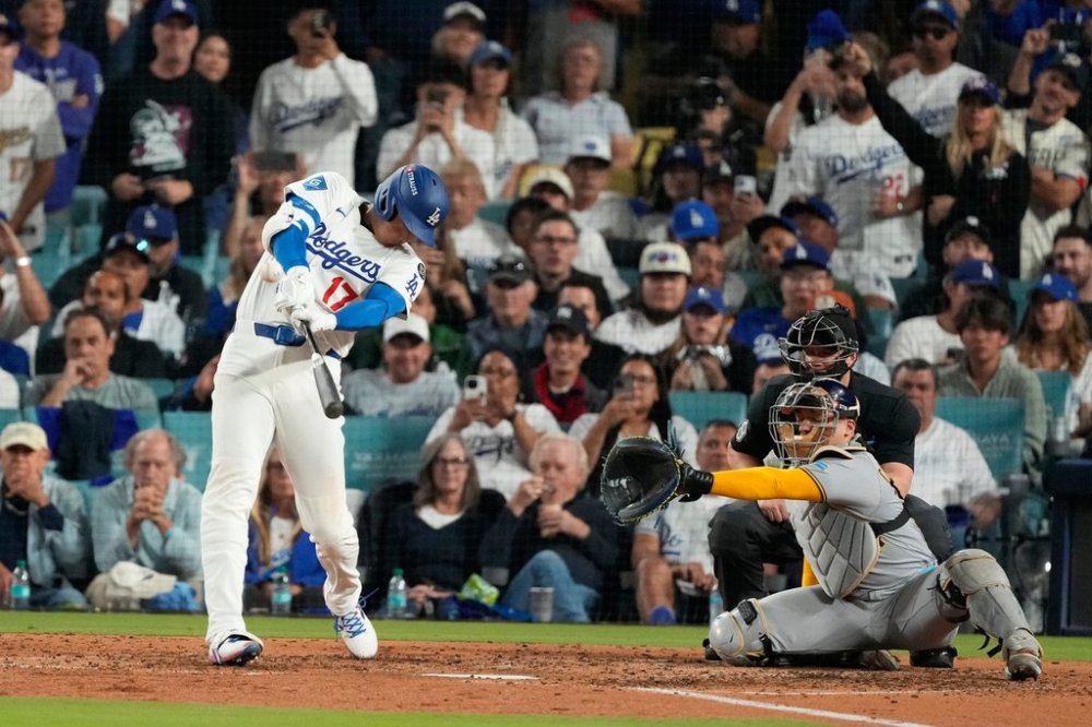 Los Angeles Dodgers' Shohei Ohtani celebrates his home run against the Milwaukee Brewers during the seventh inning in Game 4 of baseball's National League Championship Series, Friday, Oct. 17, 2025, in Los Angeles. (AP Photo/Mark J. Terrill)