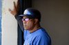 FILE - New York Mets coach Sandy Alomar Sr. watches from the dugout as the Mets play the Cleveland Indians in a spring training baseball game, March 7, 2008, in Winter Haven, Fla. (AP Photo/Tony Dejak, File)