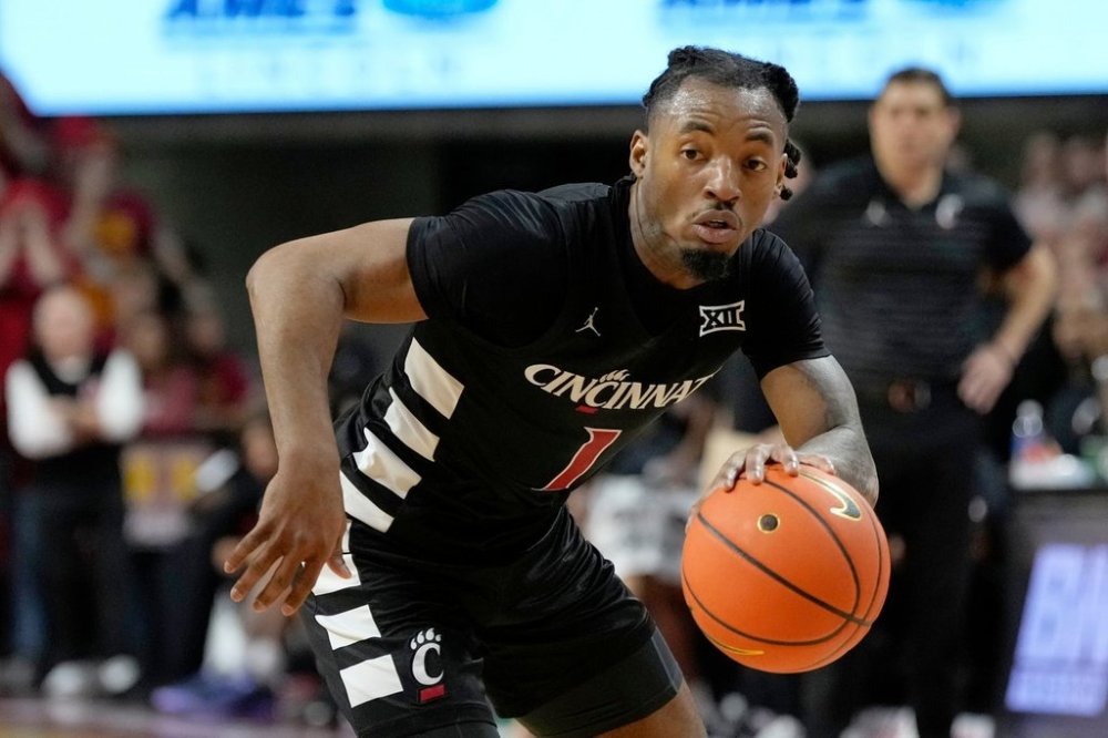 FILE - Cincinnati guard Day Day Thomas drives up court during the first half of an NCAA college basketball game against Iowa State Saturday, Feb. 15, 2025, in Ames, Iowa. (AP Photo/Charlie Neibergall, File)