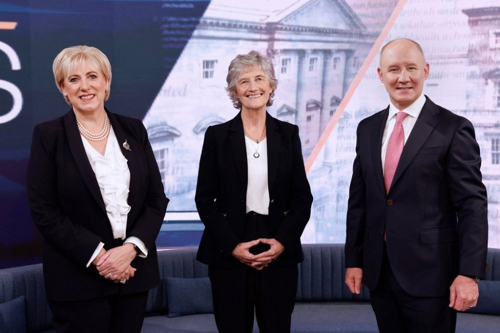 Irish presidential candidates, from left, Fine Gael's candidate Heather Humphreys, independent candidate Catherine Connolly, who is backed by Sinn Fein and Fianna Fail candidate Jim Gavin, pose for a photo during a debate on The Week in Politics at RTE studios in Donnybrook, Dublin, Sunday, Oct. 5, 2025. (Conor O'Mearain/PA via AP)