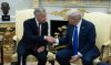 Prime Minister Mark Carney shakes hands with United States President Donald Trump at the start of a meeting in the Oval Office in the White House, in Washington, D.C. Tuesday, Oct. 7, 2025 in Washington. THE CANADIAN PRESS/Adrian Wyld