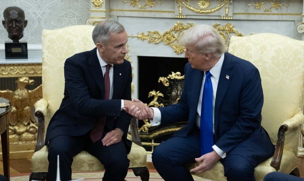 Prime Minister Mark Carney shakes hands with United States President Donald Trump at the start of a meeting in the Oval Office in the White House, in Washington, D.C. Tuesday, Oct. 7, 2025 in Washington. THE CANADIAN PRESS/Adrian Wyld