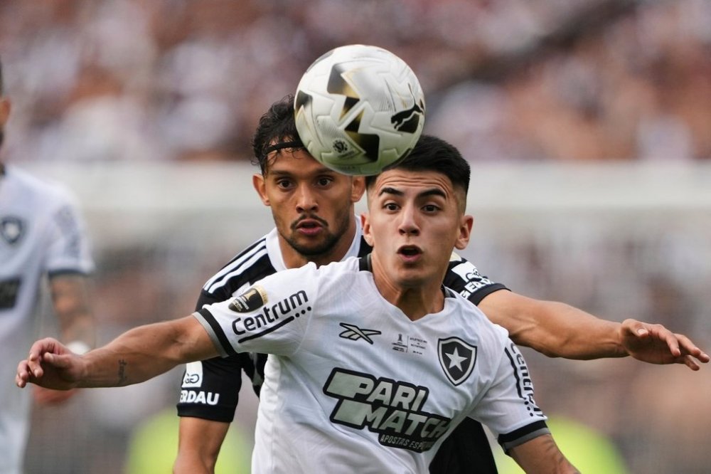 Thiago Almada, front, of Brazil's Botafogo, and Gustavo Scarpa of Brazil's Atletico Mineiro battle for the ball during a Copa Libertadores final soccer match at Monumental stadium in Buenos Aires, Argentina, Saturday, Nov. 30, 2024. (AP Photo/Gustavo Garello, File)