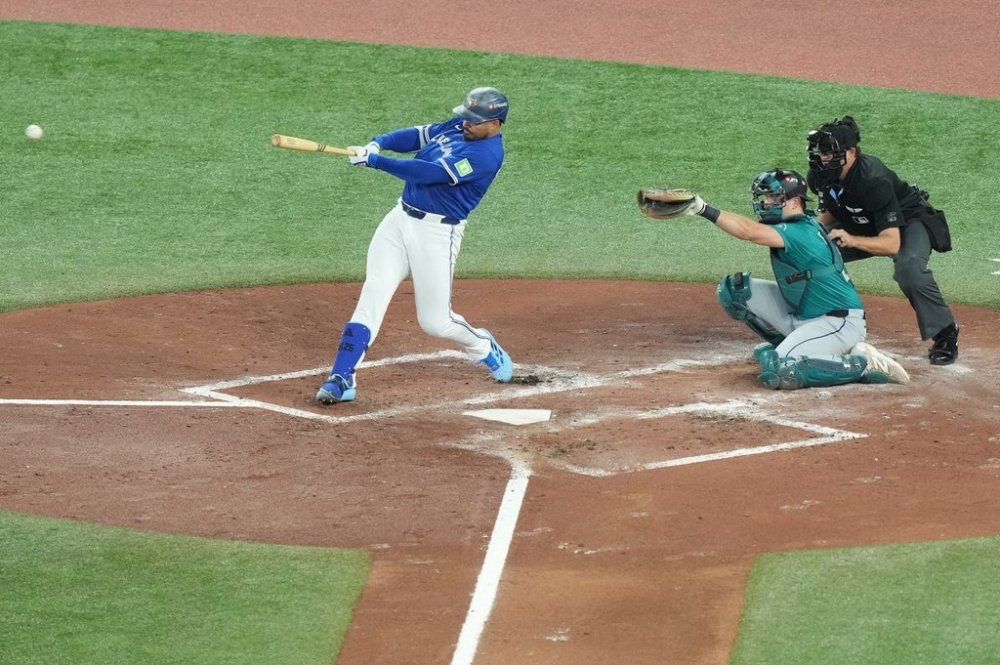 Blue Jays right-fielder Anthony Santander (25) takes a swing during the second inning of Game 1 of the American League Championship Series in Toronto on Oct. 12, 2025. THE CANADIAN PRESS/Nathan Denette