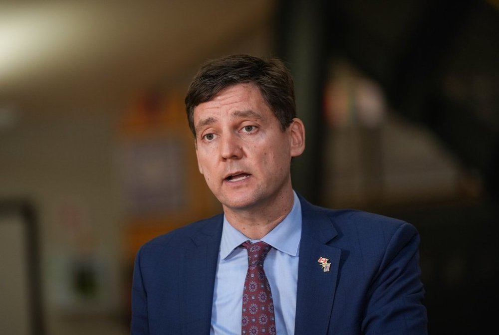 Students watch as B.C. Premier David Eby speaks during a news conference at Clayton Heights Secondary School, in Surrey, B.C., on Thursday, Sept. 4, 2025. THE CANADIAN PRESS/Darryl Dyck